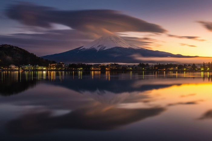 Mount Fuji reflected in a lake at dusk