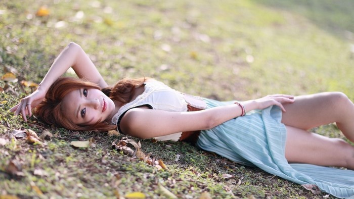 Woman Lying on Grass in Spring Light