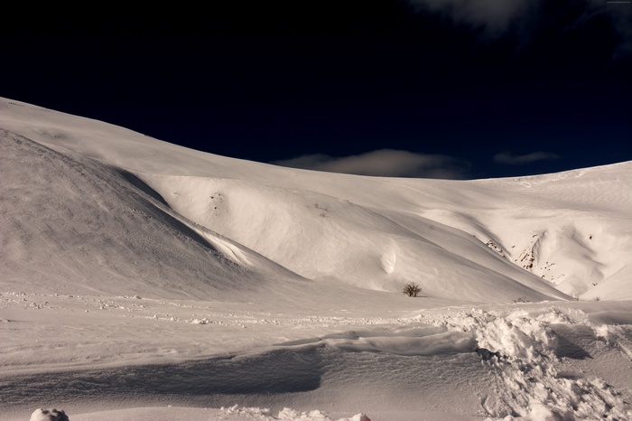 Snowy hills in France at night