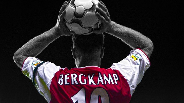 Dennis Bergkamp holding a soccer ball