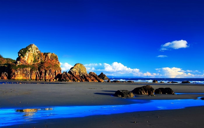 Rocky coast with blue sky and ocean