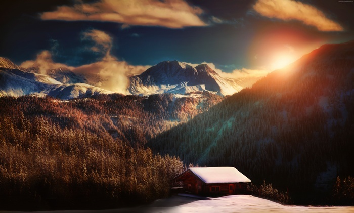 Sunset over snow-covered Alps with a cabin