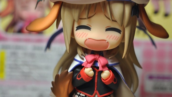 Anime figure with dog ears and pink bow