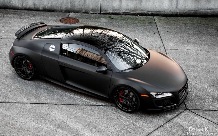Matte black Audi R8 coupe parked on concrete