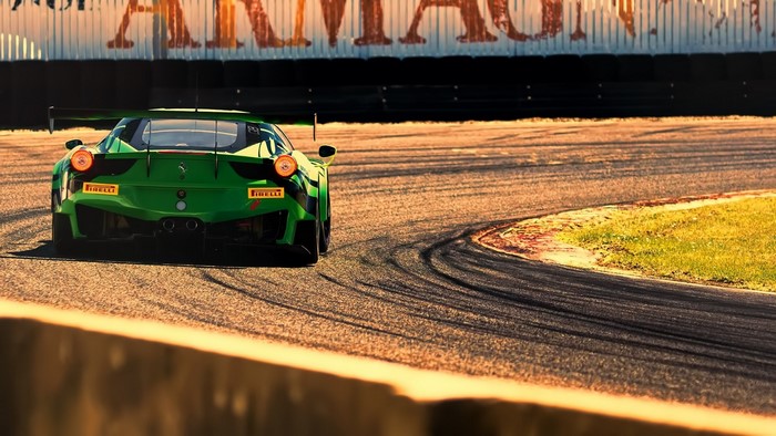 Green Ferrari 458 Italia GT3 on a race track