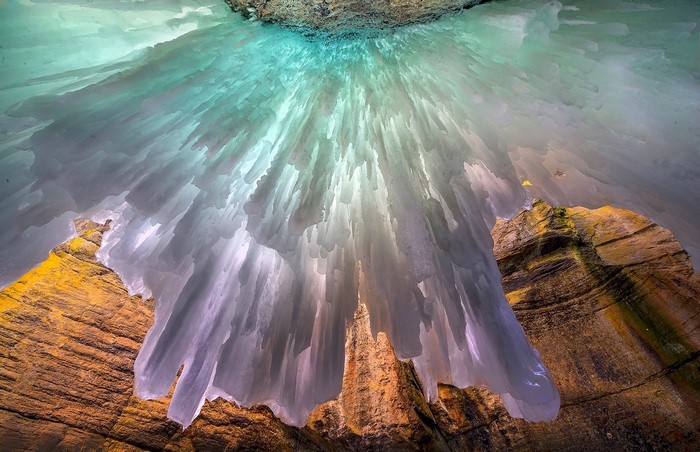 Ice formations hanging from a rocky overhang in Jasper National Park