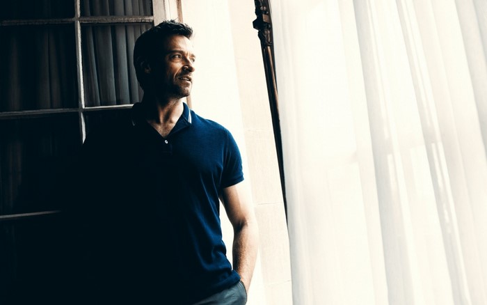 Hugh Jackman in a blue polo shirt