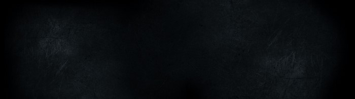 Dark textured surface with subtle lighting