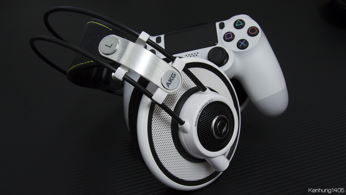AKG Q701 headphones and white PlayStation 4 DualShock 4 controller