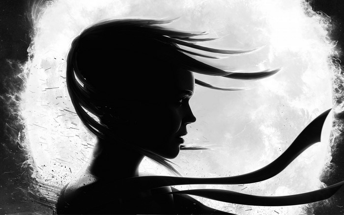 Silhouette of a woman with flowing hair against a bright background
