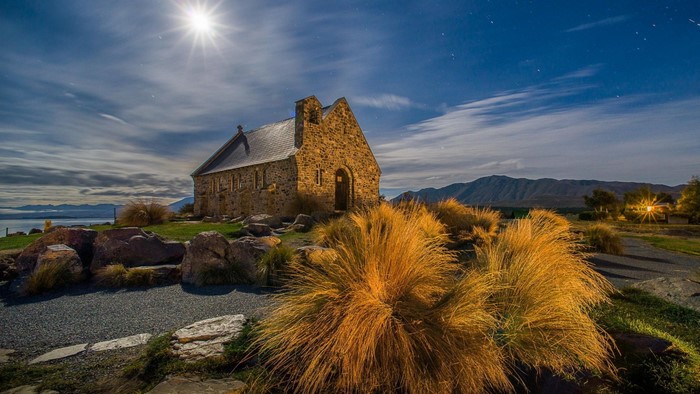 Stone church under the moon and stars