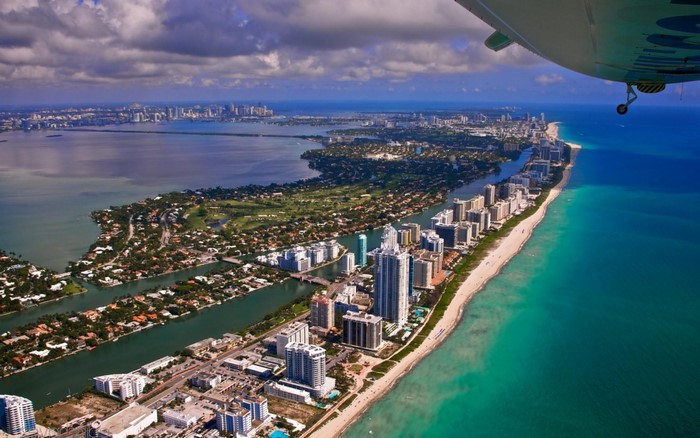 Aerial view of Miami coastline and cityscape from an aircraft
