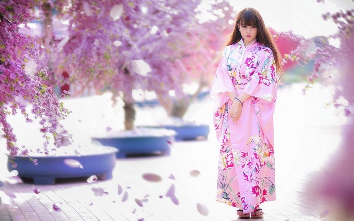 Woman in pink kimono with flowers