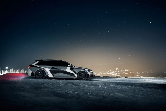 Audi RS6 Avant with camouflage wrap at night