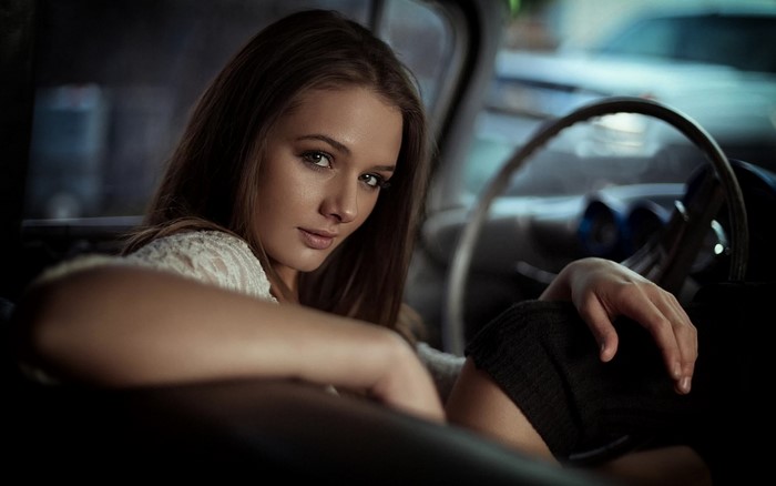 Thoughtful Woman in Car Interior