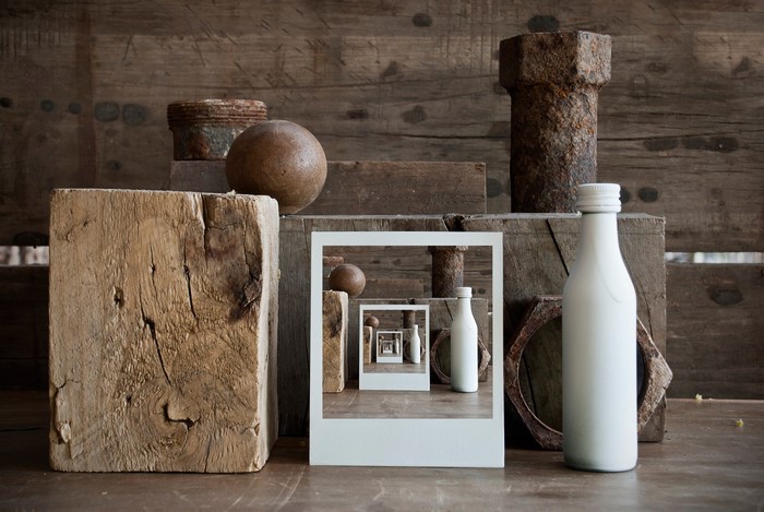 Still life with wooden objects and recursive bottles