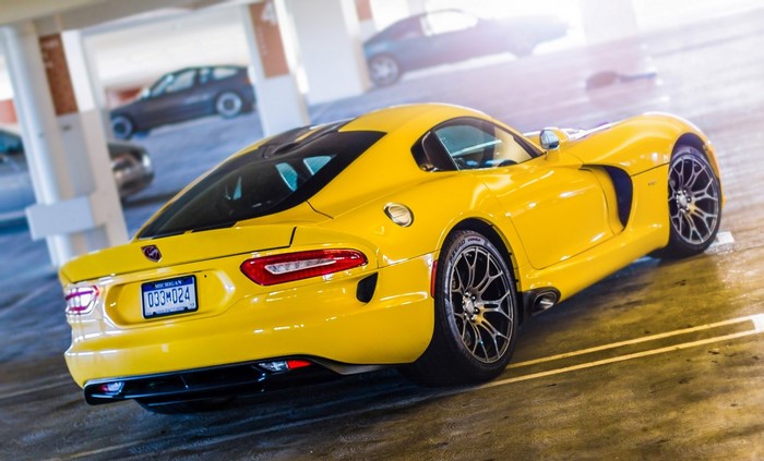 Yellow Dodge Viper SRT-10 parked in a parking garage
