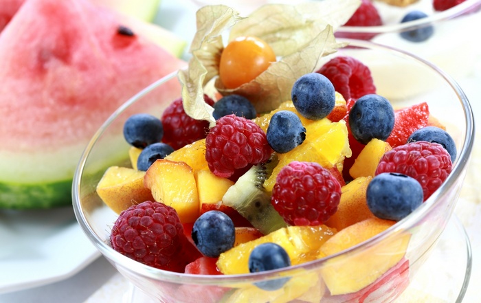 Fruit salad with watermelon, blueberries, raspberries, peaches, and kiwi