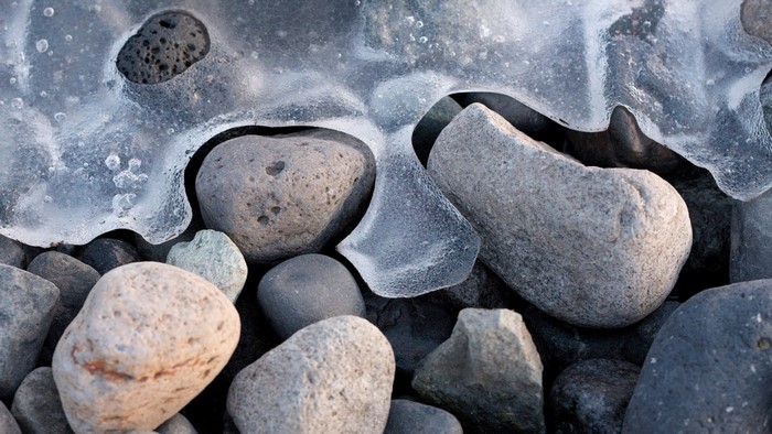 Close-up of ice and rocks on a winter day