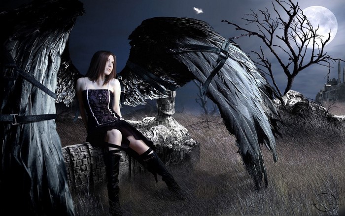 Goth girl with black wings in a dark fantasy landscape