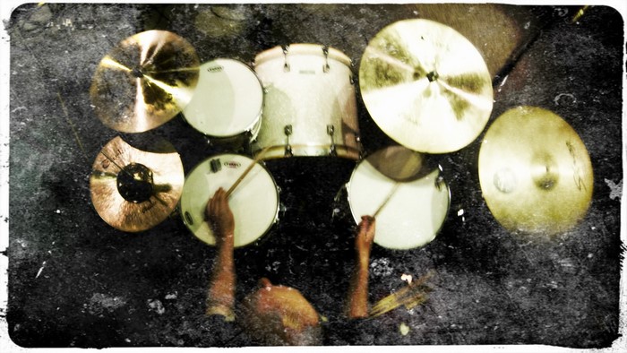 Drummer playing drums with cymbals