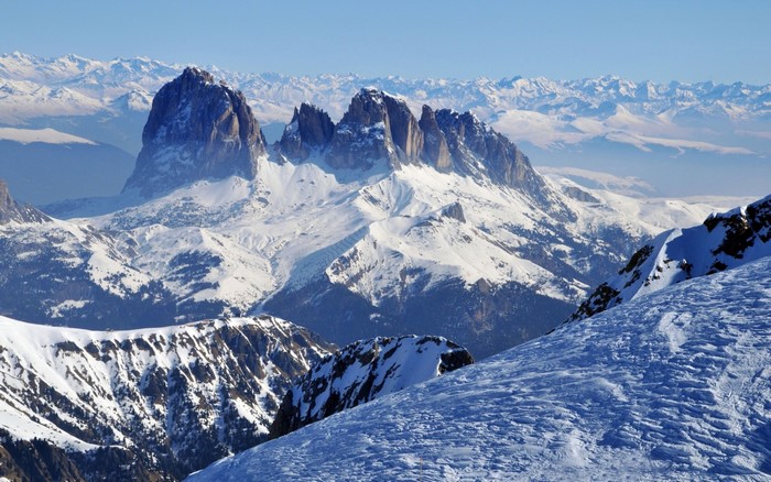 Snow-covered mountains in the Alps under a clear blue sky