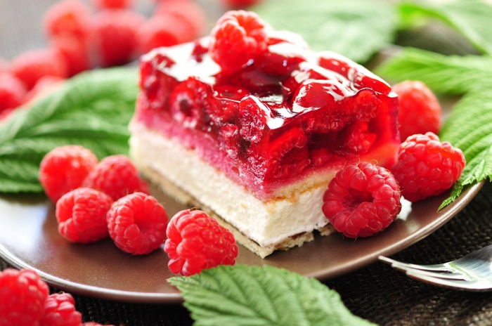 Raspberry jelly cake with fresh raspberries and mint leaves