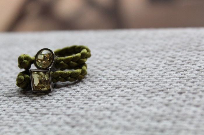 Green braided ring with square and round gems
