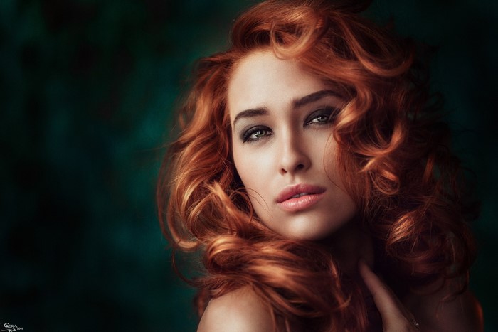 Portrait of a Redhead Woman with Curly Hair