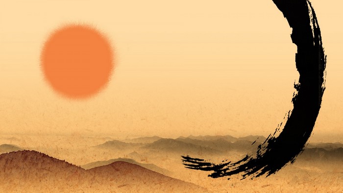 Zen circle over misty mountains at sunrise