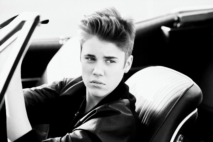 Justin Bieber in a convertible car