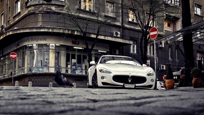 White Maserati GranTurismo parked on a city street