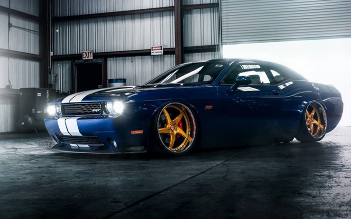 Blue Dodge Challenger SRT with custom gold rims