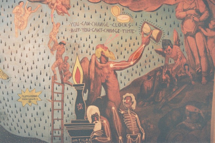 Mural with figures and text about time