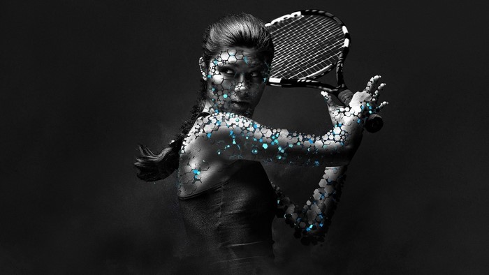 Woman with hexagonal patterns and blue accents holding a tennis racket