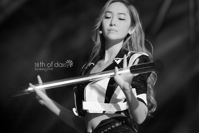 Jessica Jung holding a microphone stand