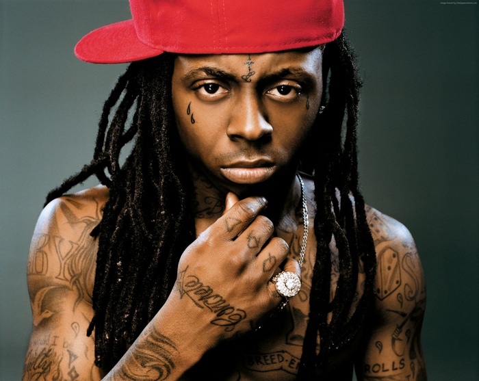Lil Wayne wearing a red cap