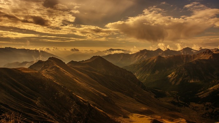 Mountain range at sunset with dramatic clouds
