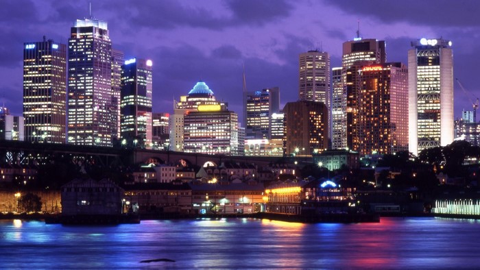Sydney skyline at night with harbor lights