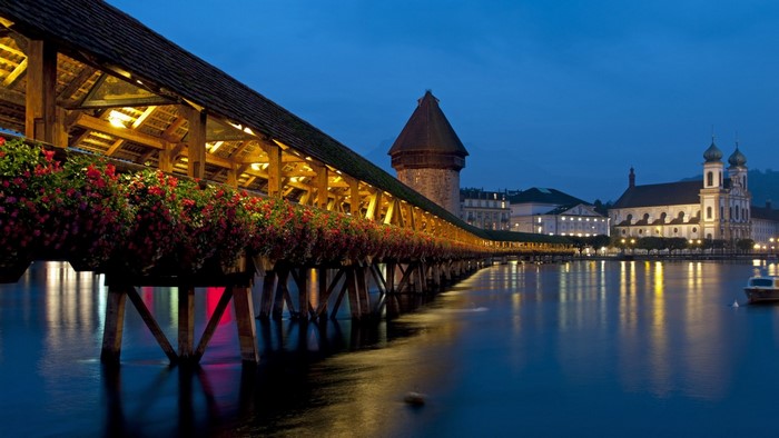 Kapellbrücke bridge with flowers at night in Luzern