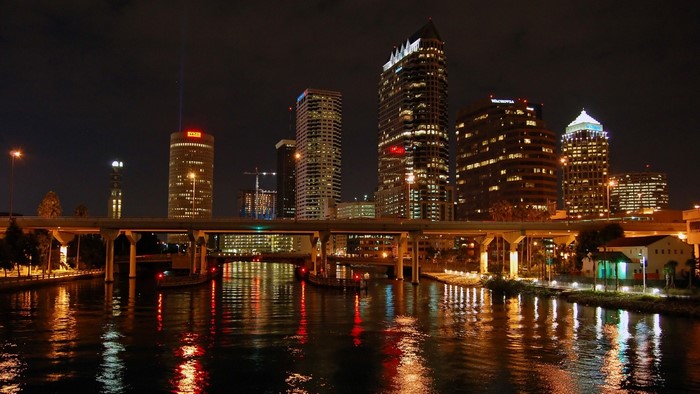 Tampa cityscape at night with reflections on the water