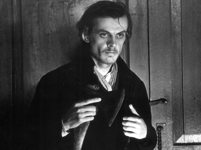 Man holding an axe in black and white