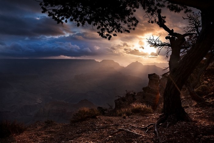 Grand Canyon at sunset with sun rays