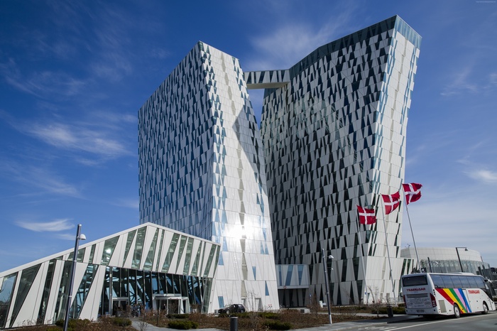 Hotel Bella Sky in Copenhagen, Denmark with Danish flags and bus