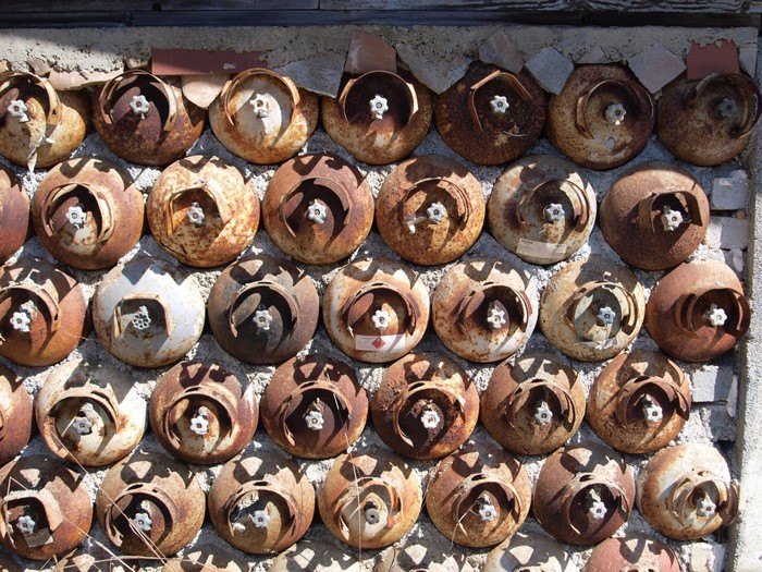 Wall made of rusted propane tanks