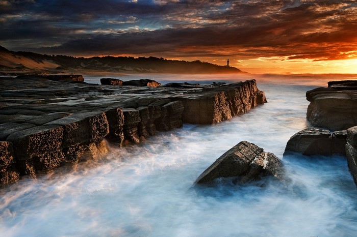 Sunset Over Rocky Coastal Bay