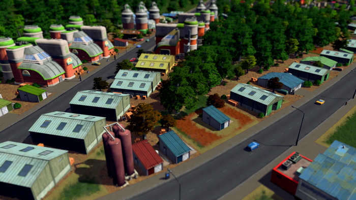 Cityscape with industrial buildings and trees