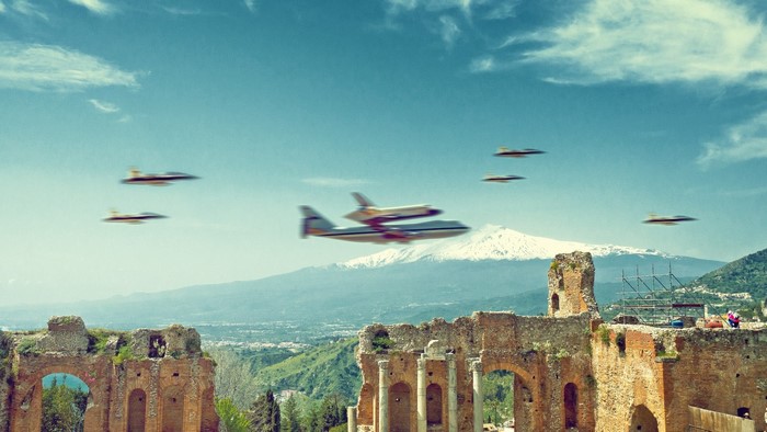 Space Shuttle and Fighter Jets over Ancient Ruins and Volcano