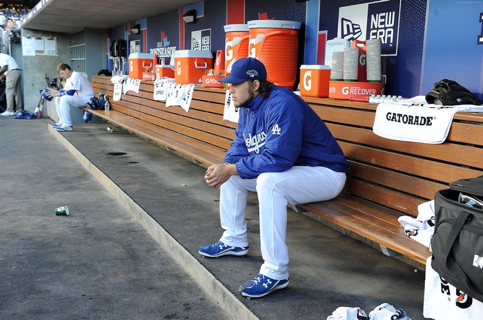 Clayton Kershaw of the Los Angeles Dodgers sitting in the dugout