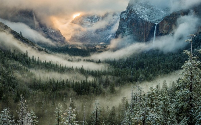 Misty Yosemite Valley with Waterfalls and Snow-Covered Trees